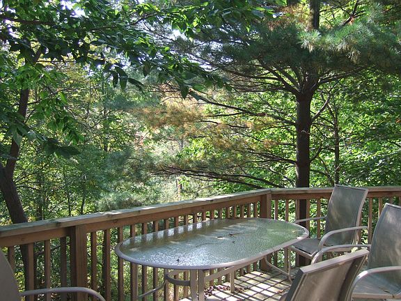 Overlooking wooded lot