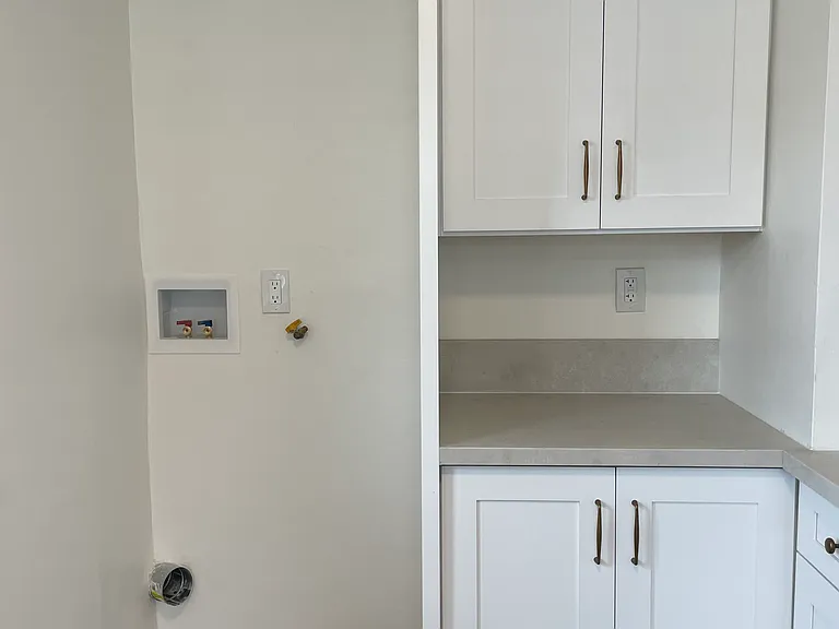 Laundry hook-up ready for your stacker washer/dryer. Additional pantry storage!