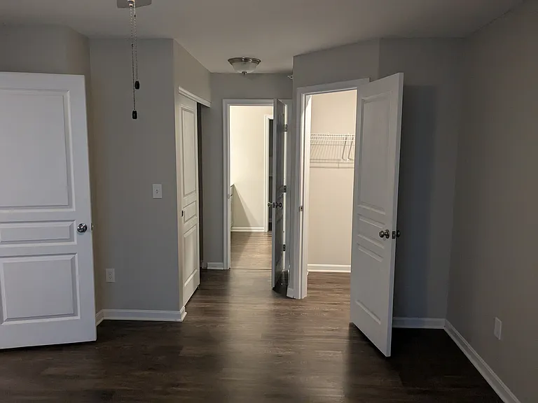Master bedroom showing closet to left and right. Straight through is bathroom.