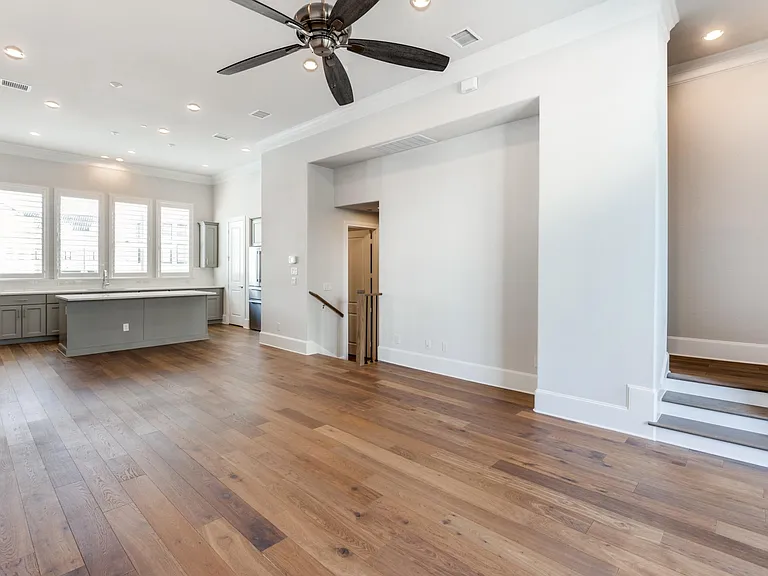 2nd floor living room features 12ft ceilings and crown molding.