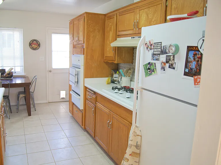 Kitchen with door to side yard