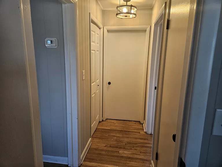 Hallway to 2 bedrooms and bath. 2 spacious closets