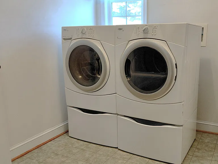 Private in-unit washer & dryer installation in progress _ dedicated tenant laundry area expected within approximately 1_2 week