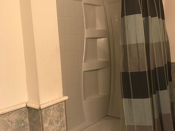 Bathtub with marble tile