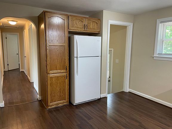 Kitchen is off hallway, back exterior door & lower level
