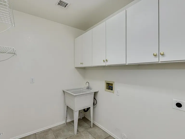 Laundry Room with Brand New Samsung Washer/Drier and Sink