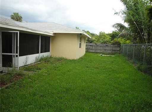 Fenced and landscape backyard with garden