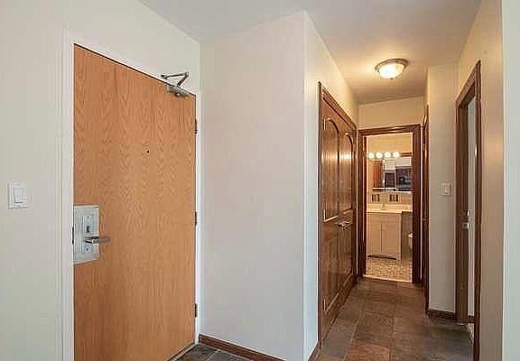 Large entryway with linen closet and large hall closet.