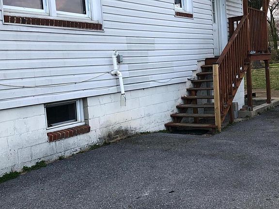 Side of building leading to the basement unit