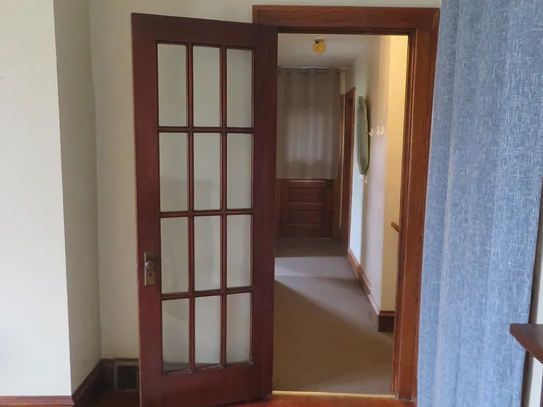 Hallway at top of the stairs from LR. Door to deck