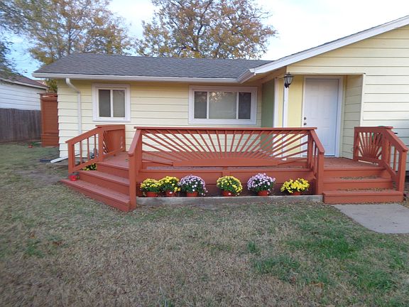front deck inside of cedar privacy fence