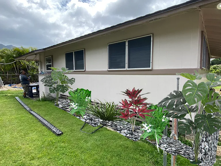 Private fenced backyard with lush green lawn and tropical landscaping_perfect for outdoor entertaining, relaxing, pets (with approval), or simply enjoying the peaceful Waimanalo lifestyle just steps from the beach. ______