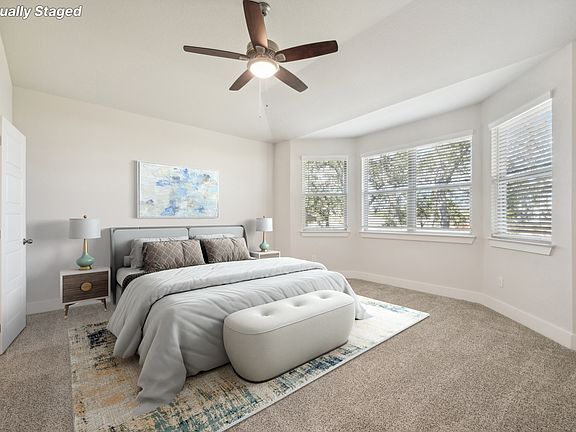 Virtually staged primary suite in the Medina floorplan at a Meritage Homes community.