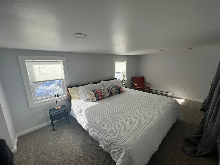 This king bedroom is spacious and comfortable with ample closet storage as well.