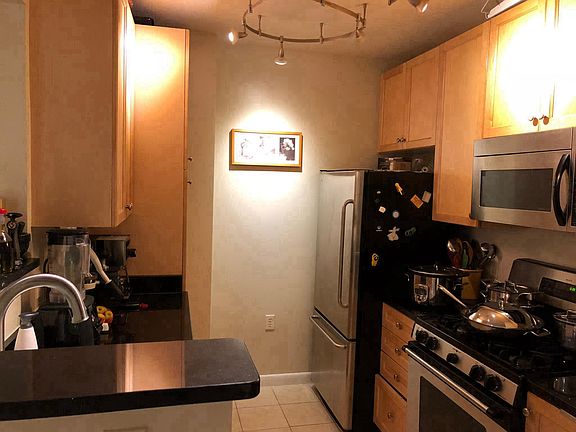 Open kitchen, steel appliances, ceramic tiles