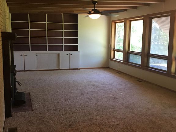Other side of living room looking at the built in shelving a