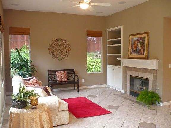 Family room w/ fireplace, built in entertainment center & surround sound.