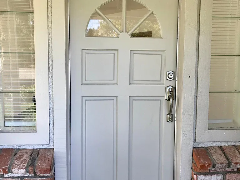 Lovely entrance with sidelight windows all new hardware, covered front porch