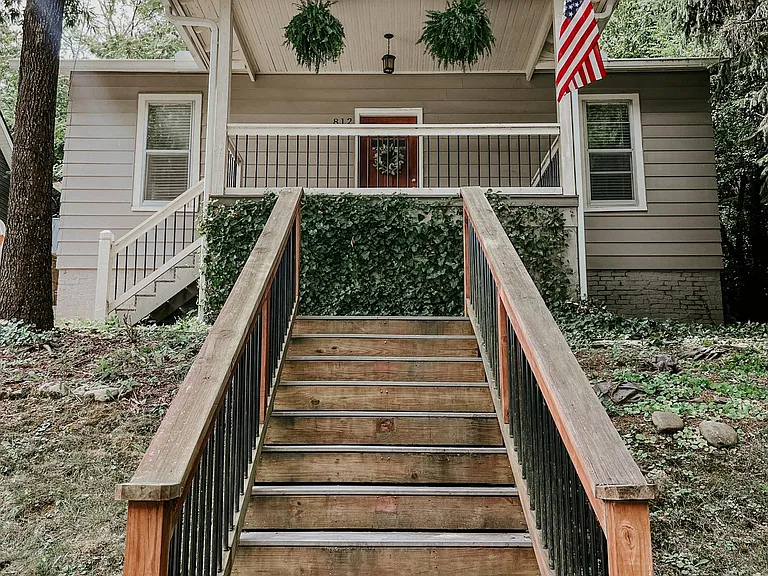 New stairs leading from the driveway up to the front porch