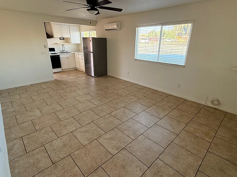 Living area (taken from the left of front door), next to closet
