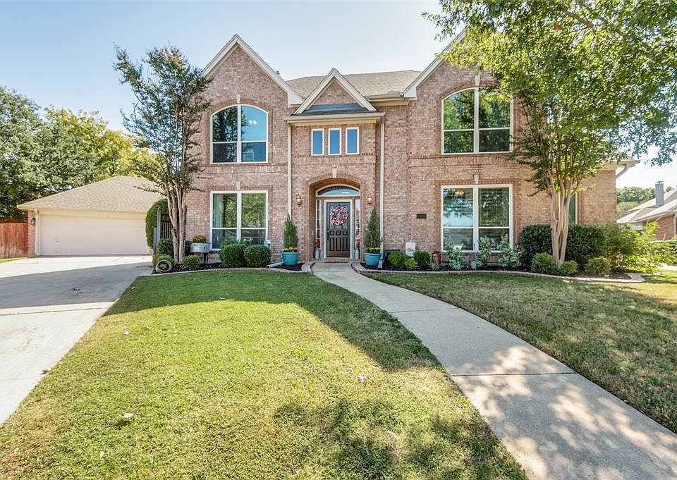 Meticulously Manicured Yard and Home; Two Car Garage is Also Attached to Single Car Stall for Workshop