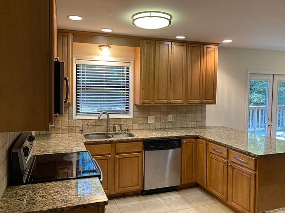 lazy susan in the corner by dishwasher, filtered water