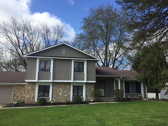 Large covered porch and right on paved bike trail. 2.5-car garage