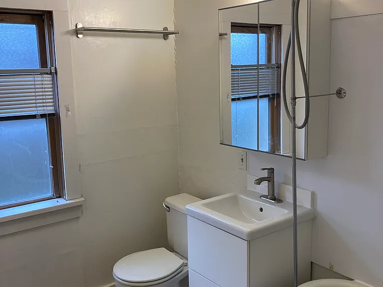 Full bath for first-floor bedroom with clawfoot tub/shower, new vanity, new toilet