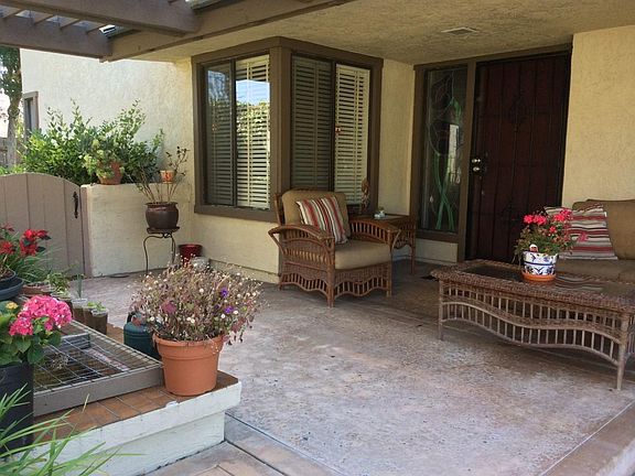 GATED COVERED PATIO AT ENTRY
