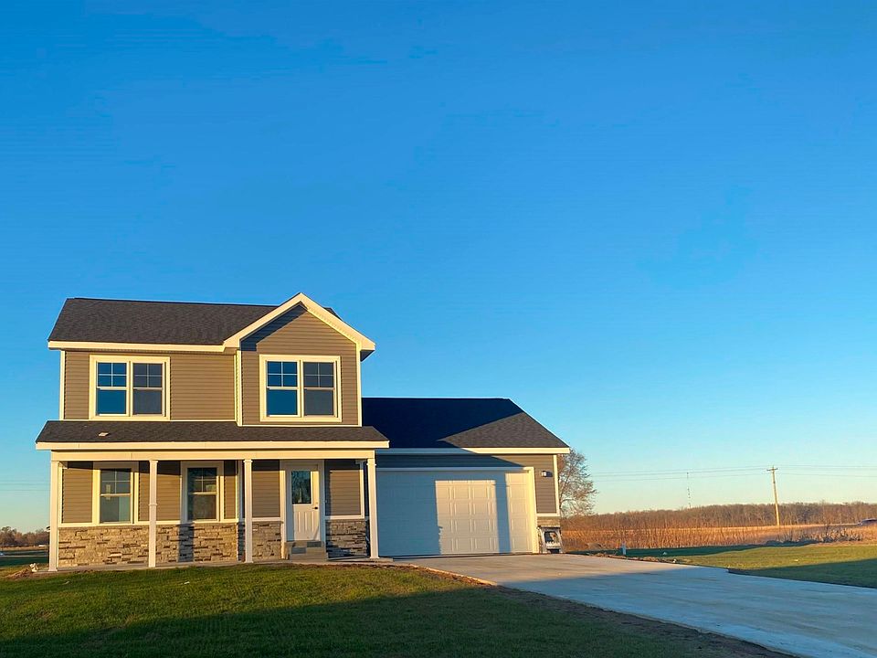 3 bedroom 2 1/2 bath 2 car attached garage on half an acre in Iris Winds 2 with an additional 1/2 ac