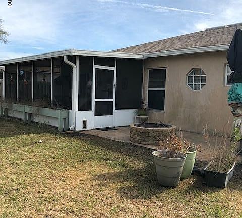 Rear screened porch/firepit