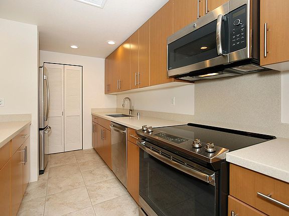 Galley style kitchen! Stainless steel appliances. Lots of counter space, cabinetes and a pantry.