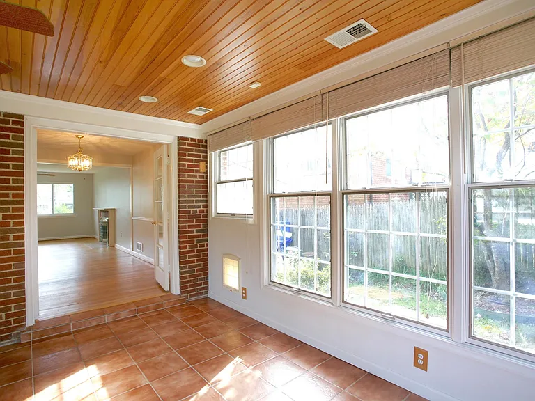 Dining room flows into the sun room.