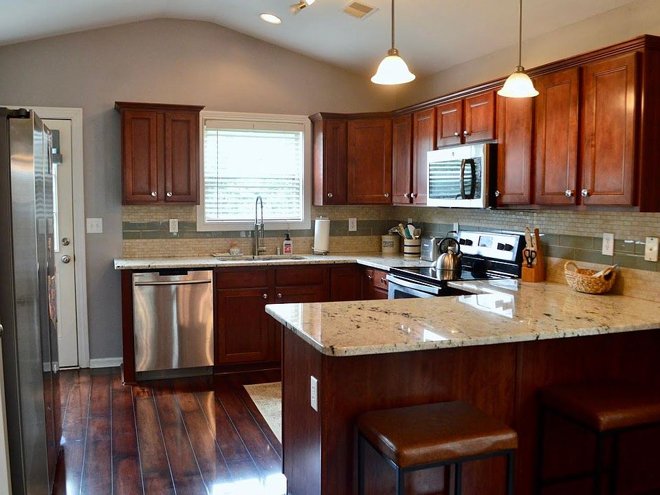Granite countertops and tile backsplash