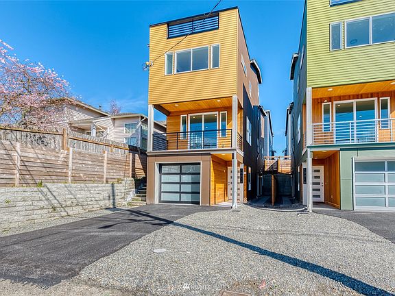 Panoramic mountain, water and city views. Modern elegance, exquisite sophistication & luxe finishes. Welcome to Release III of these new construction homes on 21st Ave SW. Model home is Unit 10016 on the left.