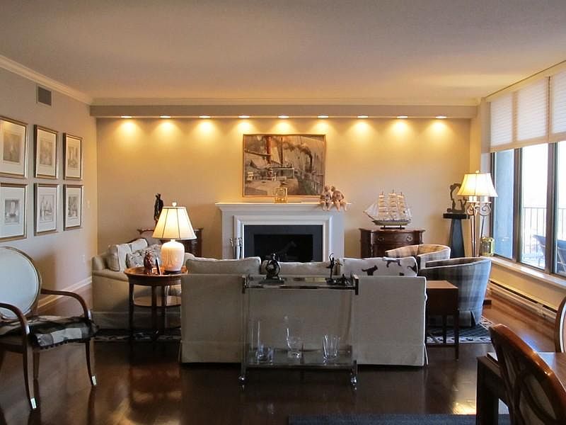 Living room with fireplace and views