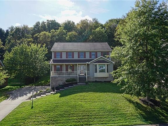This cul de sac home site is private with a mature tree lined back yard.