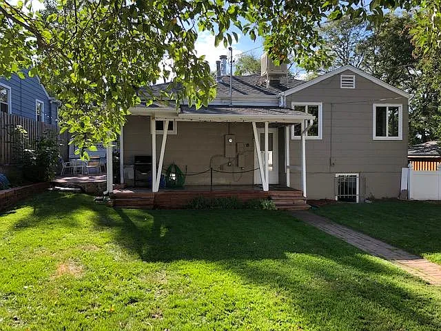 Covered flagstone patio and fenced back yard