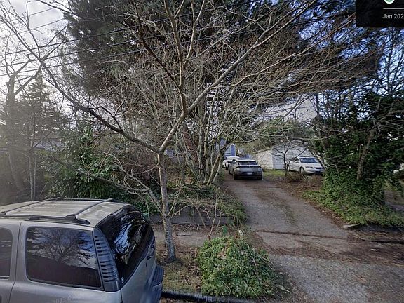 Driveway facing front of house with lots of parking from the street