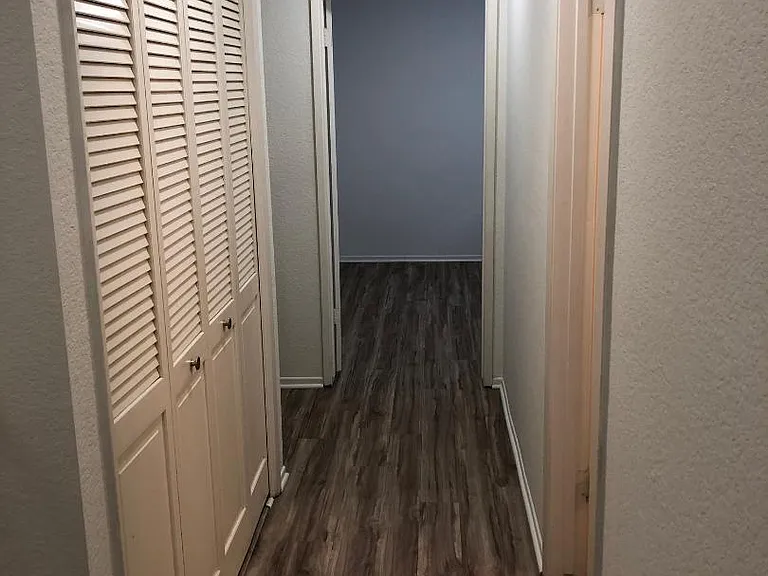 Upstairs hallway leading to 2nd bedroom and past the washer dryer closet