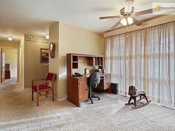From front entryway you come to the dining area being used as an office area presently. Lots of floor to ceiling windows in this home. Neutral decor throughout.  Seller is having carpets cleaned shortly.