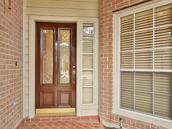 Attractive brick front porch & home bricked on all four sides.