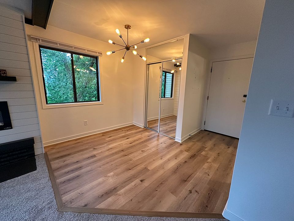 Dining room room with modern lighting and adjacent storage closet