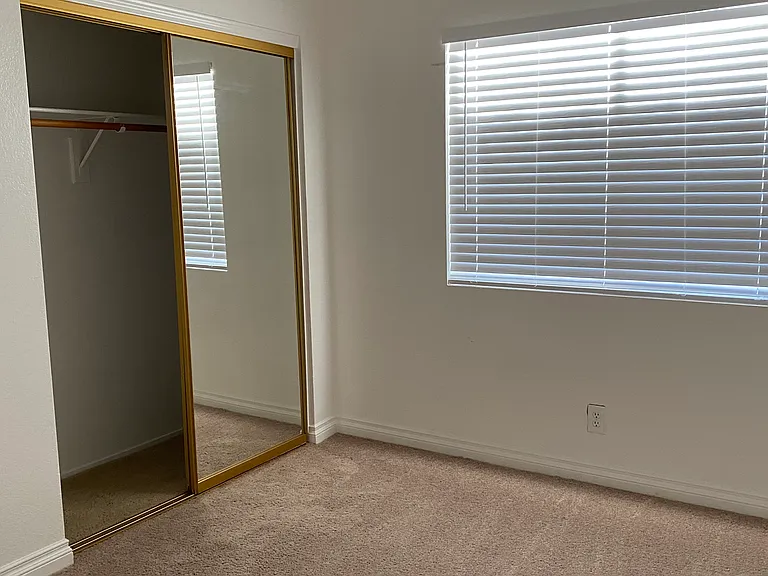 Bedroom #3 - Mirrored closet doors, ceiling fan.