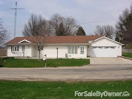 Front of home with cement patio