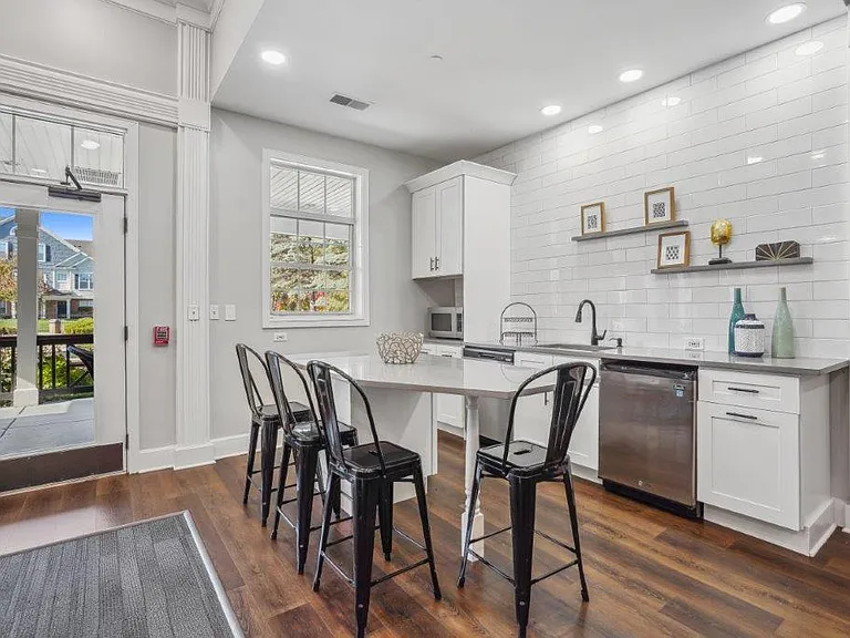 Gather for meals and conversation in a comfortable community dining space.