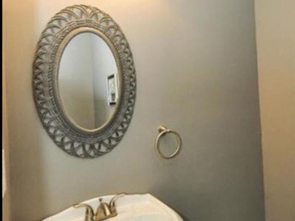 Convenient 1/2 bath off of 4 season room