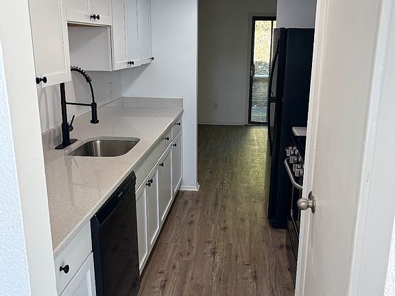 Brand new kitchen with quartz countertops.