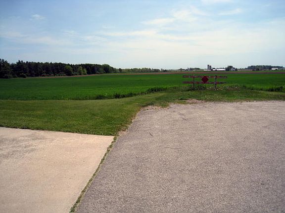 Open fields to south
