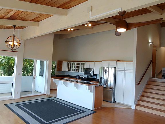 Great Room, with cathedral ceilings. Looking towards Kitchen and Entry Foyer